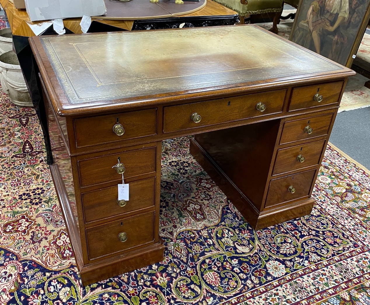 A small William Tillman reproduction George III style mahogany pedestal desk, length 112cm, depth 74cm, height 75cm